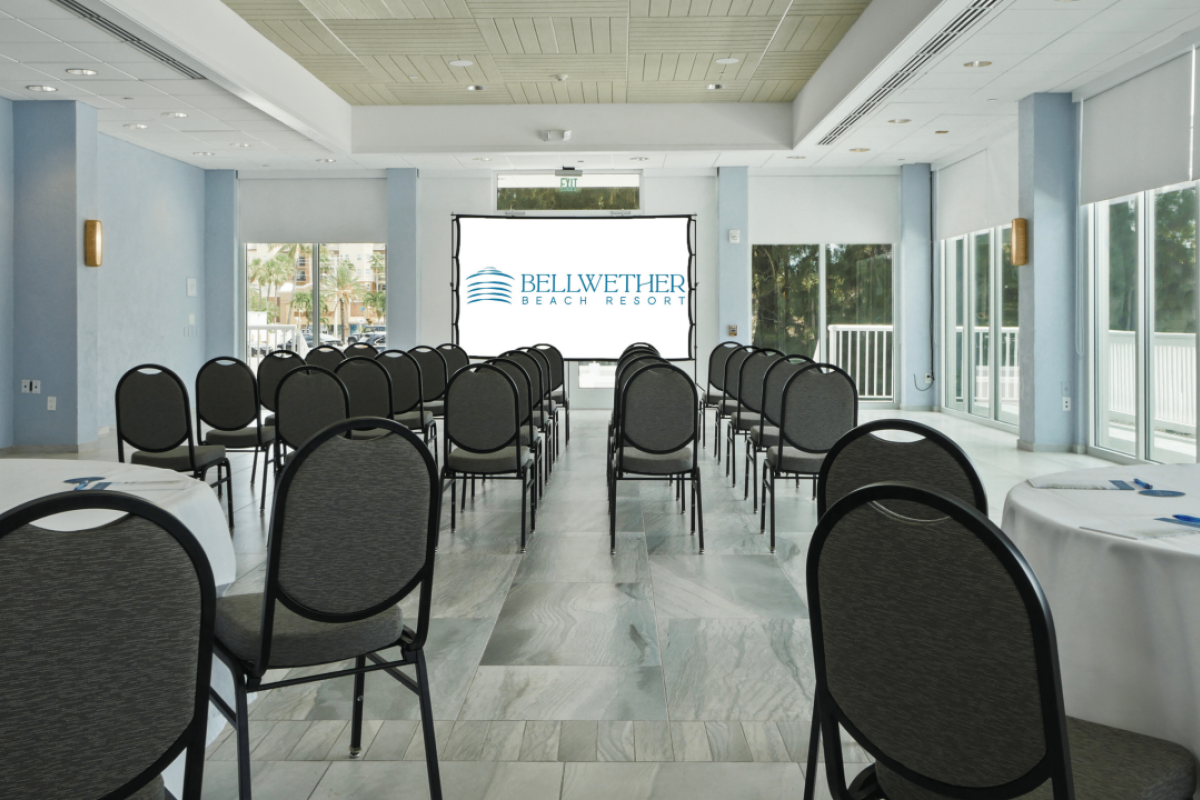 Conference room with chairs facing a presentation screen.