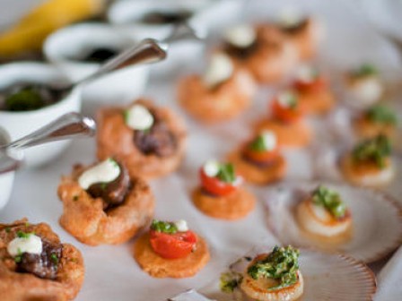 An array of appetizers on a platter, looks tasty and gourmet.