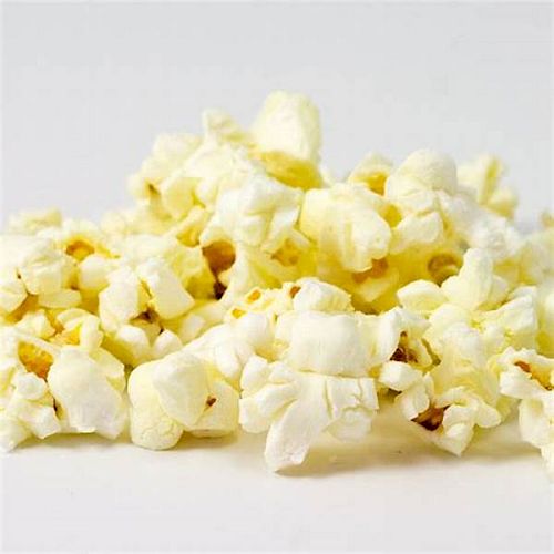 This image shows a close-up of a pile of freshly popped popcorn on a light background, ready for snacking.