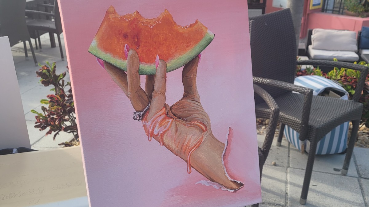 Painting of a hand holding a juicy watermelon slice.