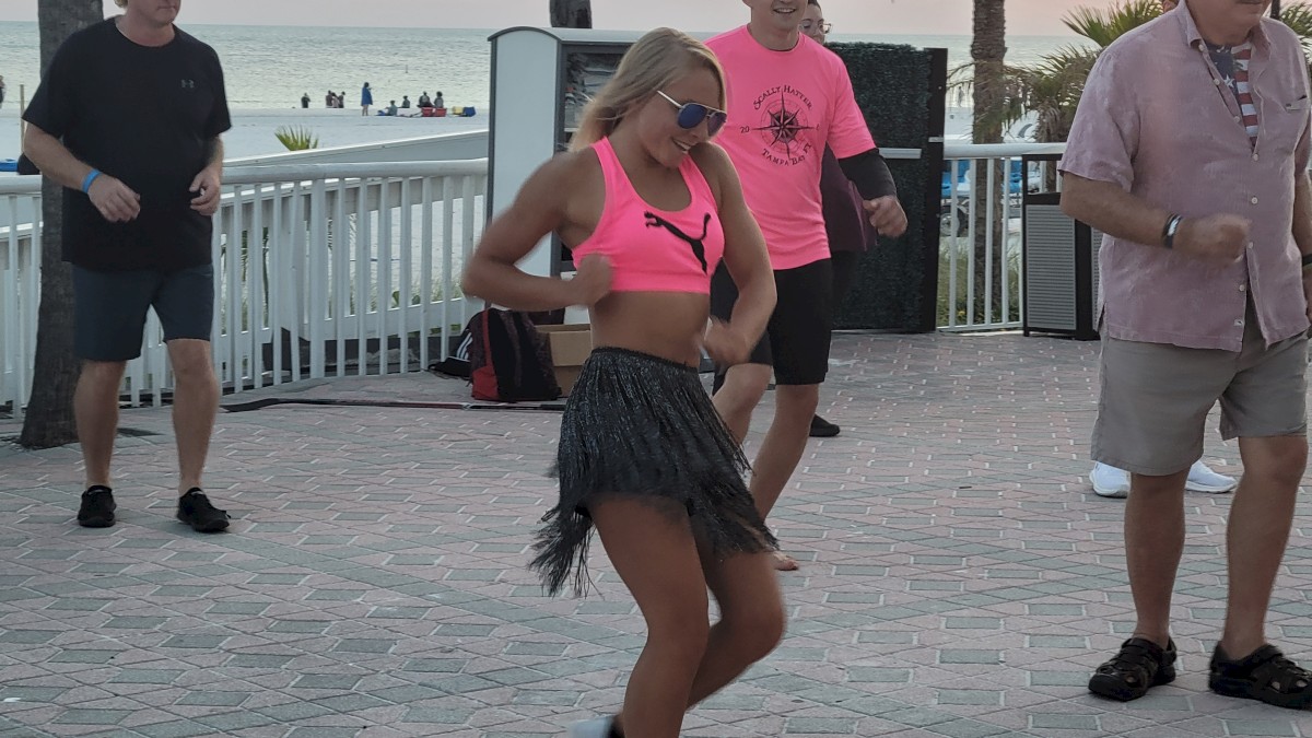 Jillian teaching Zumba poolside.