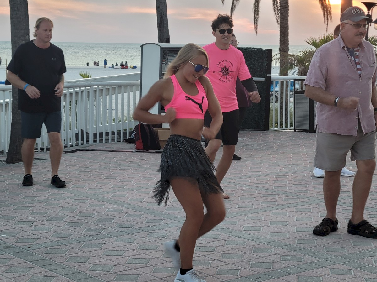 Jillian teaching Zumba poolside.